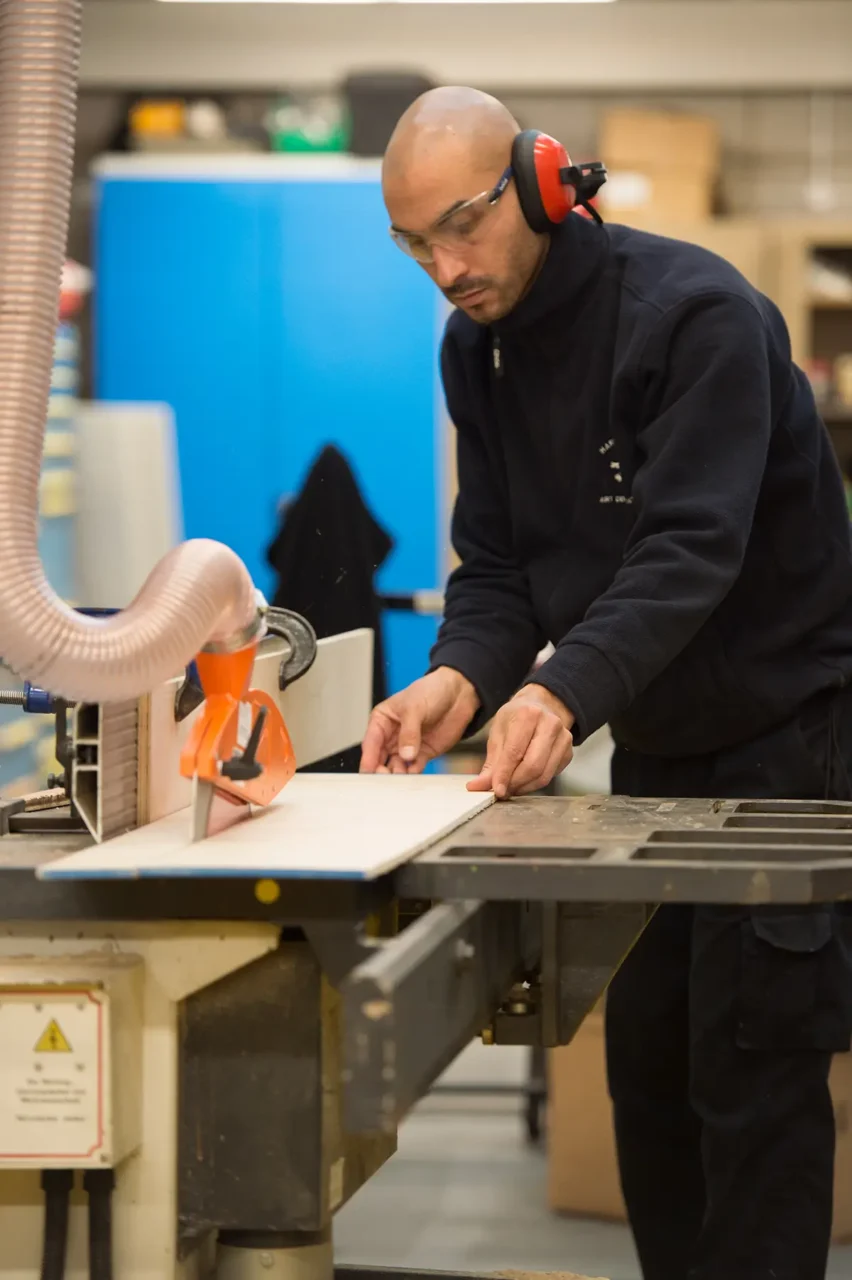 FF&E Manufacturing in progress - man using CNC machine